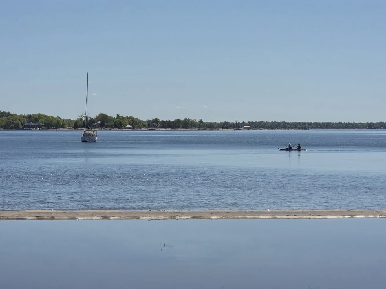 A sailboat and paddlers off Beausoleil Island on Georgian Bay